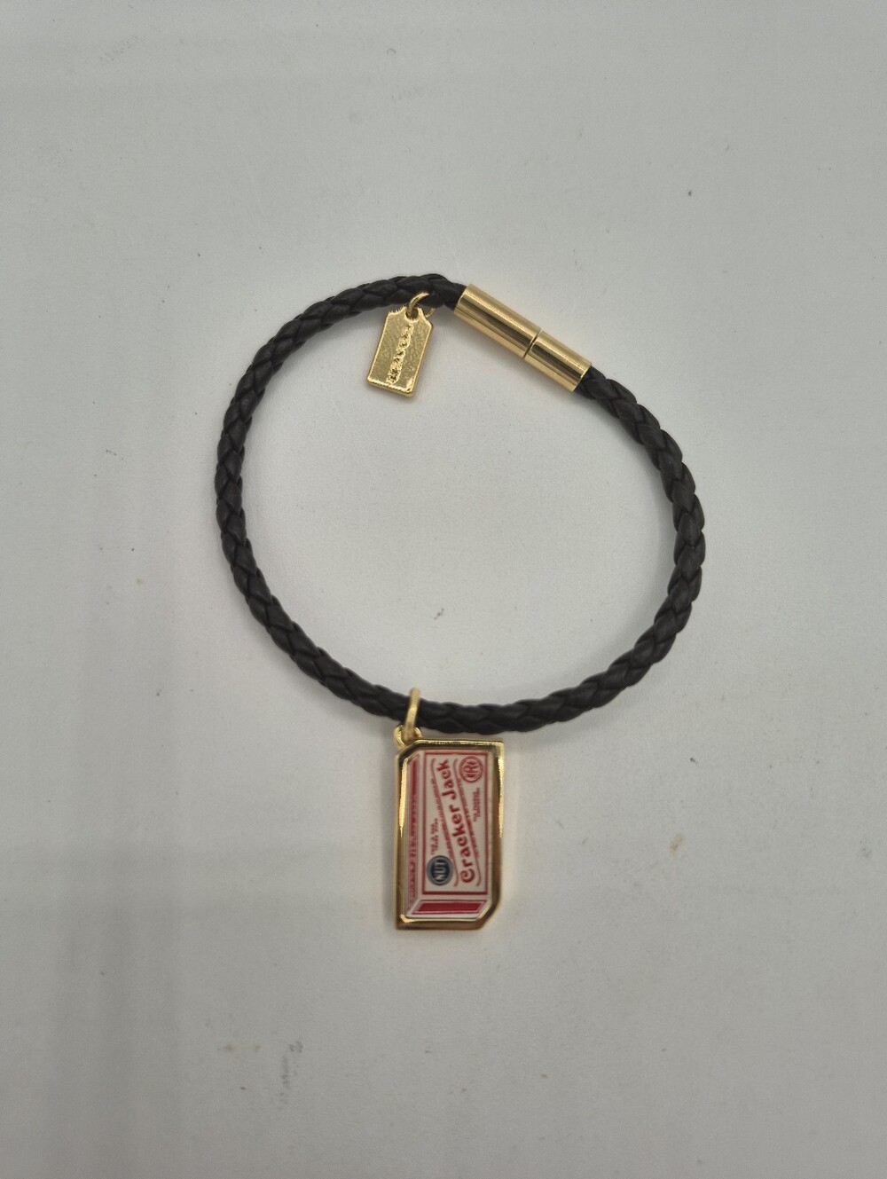Coach Black Braided Leather Bracelet with Gold and Red Tag Charm